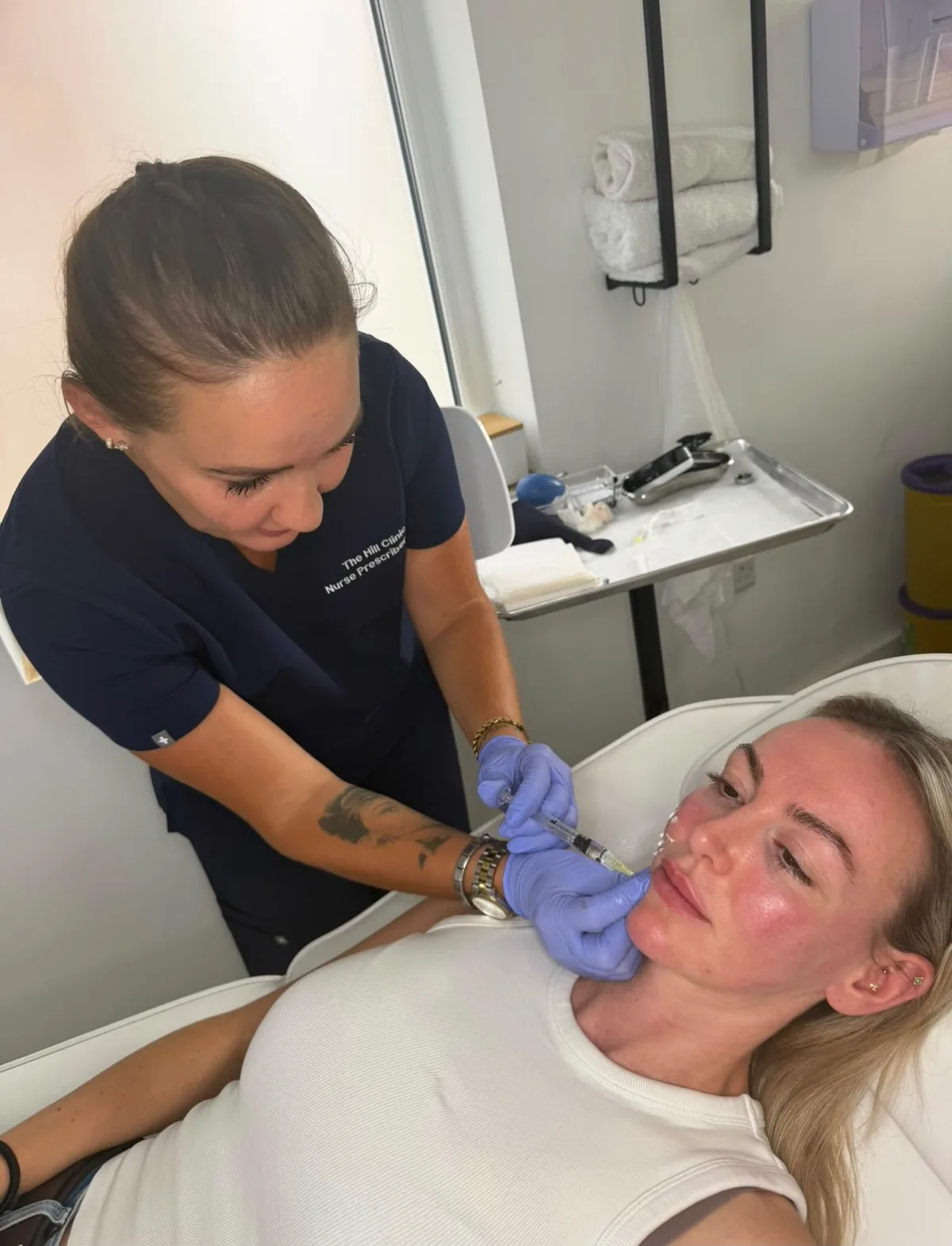 Jade Hill with a client at The Hill Clinic