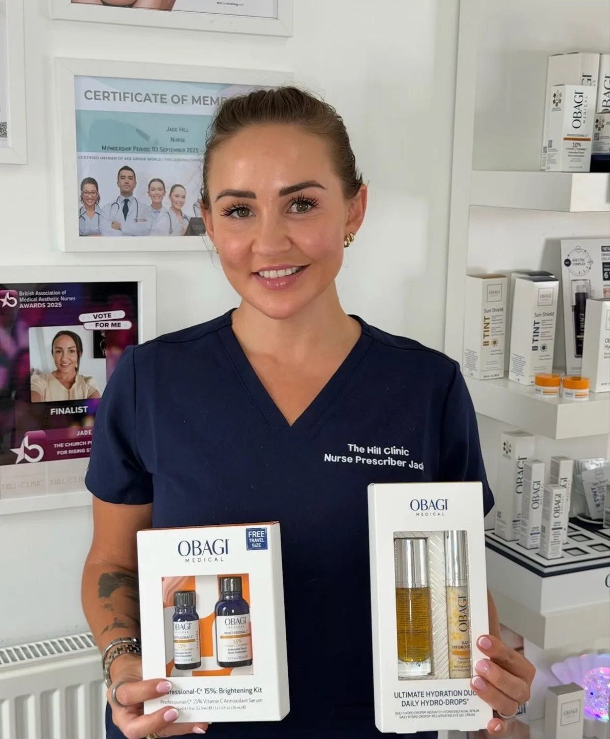 Jade Hill holding Obagi Medical skincare kits in the clinic