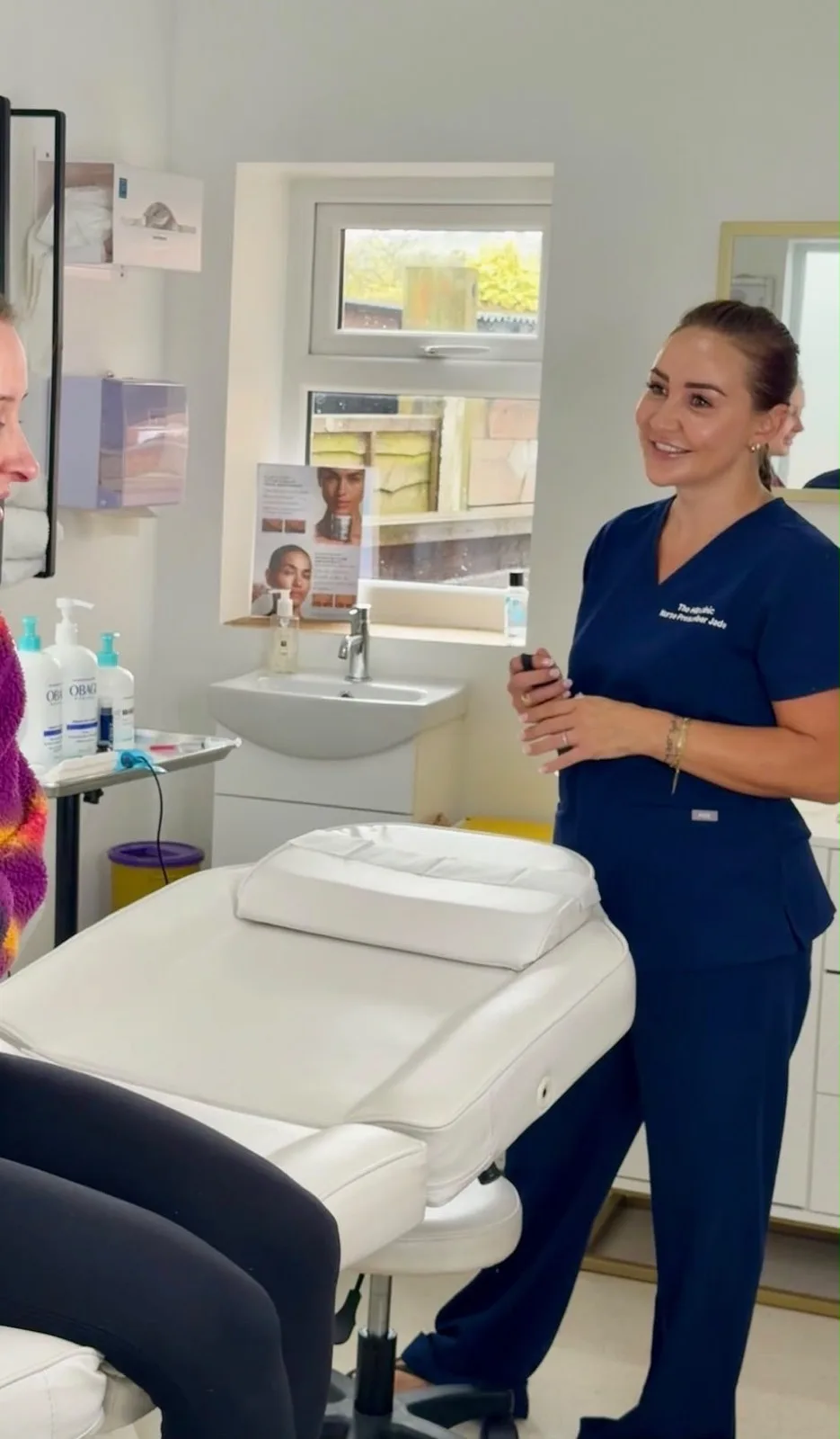 Jade Hill talking with a client in the clinic